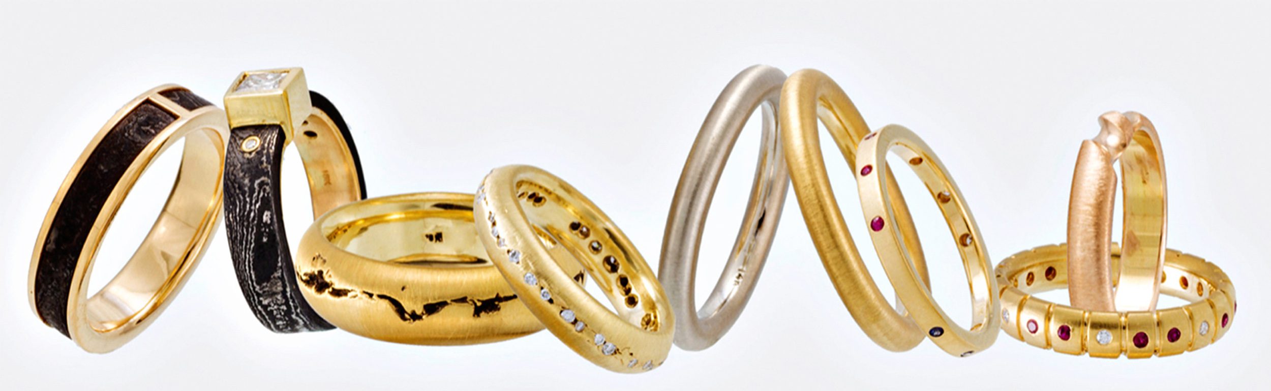 photo of various precious metal rings with gemstones by frederick jewelry photographer, Jeff Behm