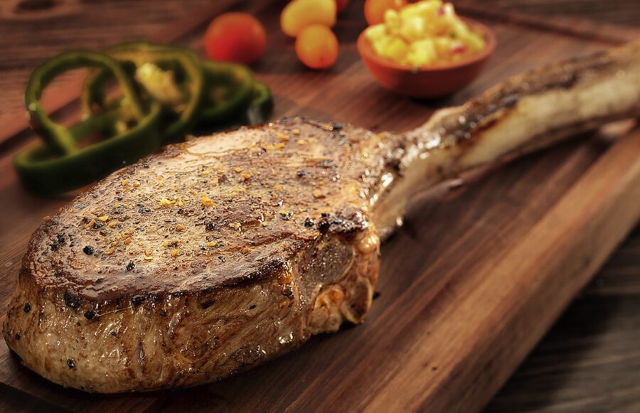 grilled tomahawk steak on cutting board by maryland food photographer Jeff Behm Studios