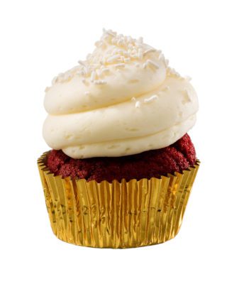 Red velvet cupcake with butter cream icing on white